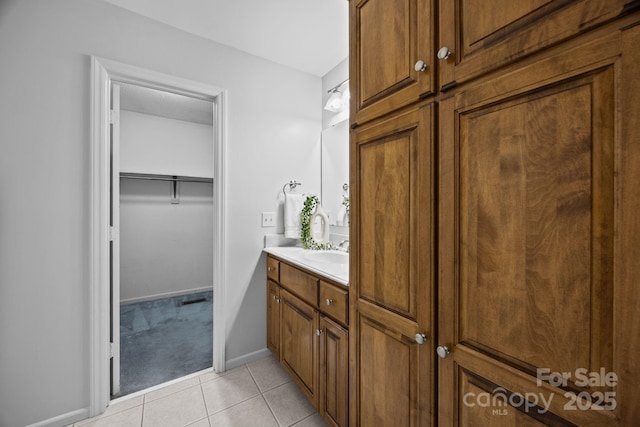 9008 St Croix Ln, Charlotte, NC 28277 - bathroom featuring vanity, tile patterned floors, and a spacious closet