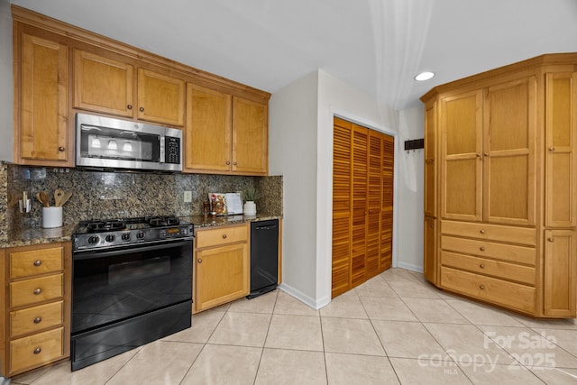 9008 St Croix Ln, Charlotte, NC 28277 - kitchen with black range with gas stovetop, stainless steel microwave, tasteful backsplash, dark stone countertops, and recessed lighting