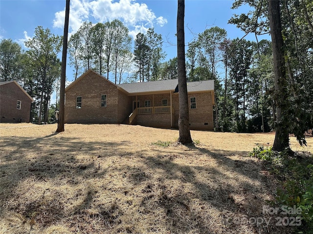 1031 Long Dr, Newton, NC 28658 - rear view of house featuring brick siding, a porch, and crawl space