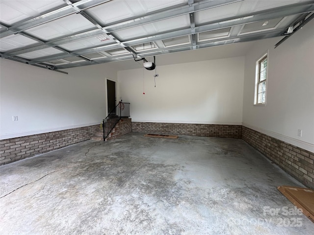 1031 Long Dr, Newton, NC 28658 - garage with a garage door opener and wainscoting