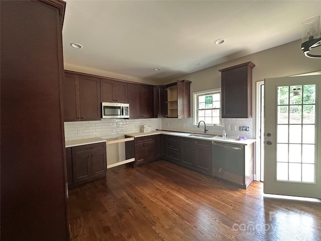 1031 Long Dr, Newton, NC 28658 - kitchen with stainless steel appliances, light countertops, decorative backsplash, dark wood finished floors, and dark brown cabinets