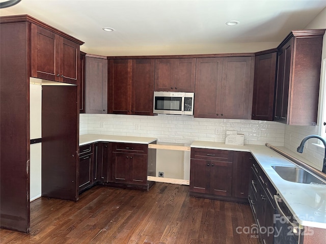 1031 Long Dr, Newton, NC 28658 - kitchen with stainless steel appliances, dark wood-style floors, tasteful backsplash, light countertops, and recessed lighting