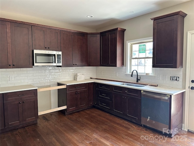 1031 Long Dr, Newton, NC 28658 - kitchen featuring stainless steel appliances, dark wood-style flooring, dark brown cabinetry, decorative backsplash, and light countertops
