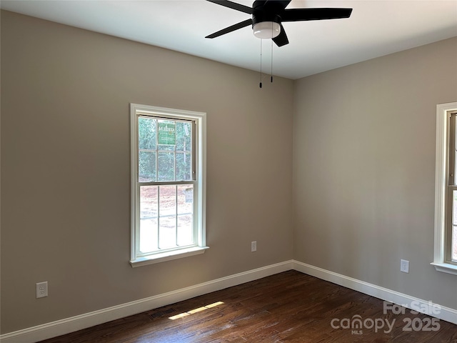 1031 Long Dr, Newton, NC 28658 - spare room featuring dark wood-style flooring and ceiling fan