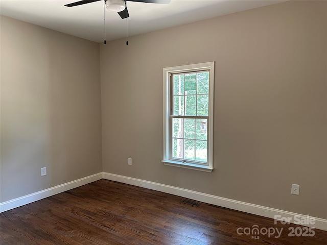 1031 Long Dr, Newton, NC 28658 - unfurnished room with plenty of natural light, dark wood finished floors, and ceiling fan