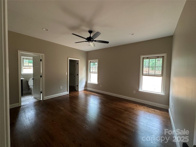 1031 Long Dr, Newton, NC 28658 - unfurnished bedroom with dark wood finished floors, ensuite bath, and ceiling fan