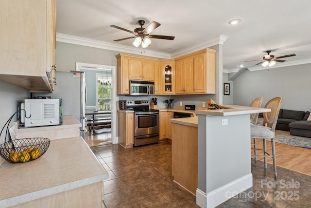 1123 Snyders Store Rd, Wingate, NC 28174 - kitchen with appliances with stainless steel finishes, ceiling fan, light brown cabinetry, a peninsula, and ornamental molding
