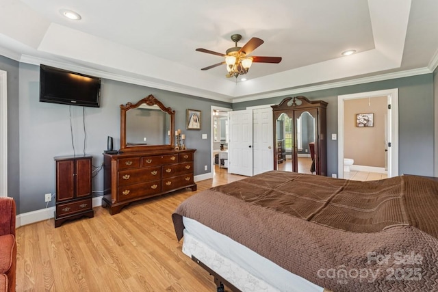 1123 Snyders Store Rd, Wingate, NC 28174 - bedroom featuring a tray ceiling, light wood finished floors, recessed lighting, ornamental molding, and ceiling fan