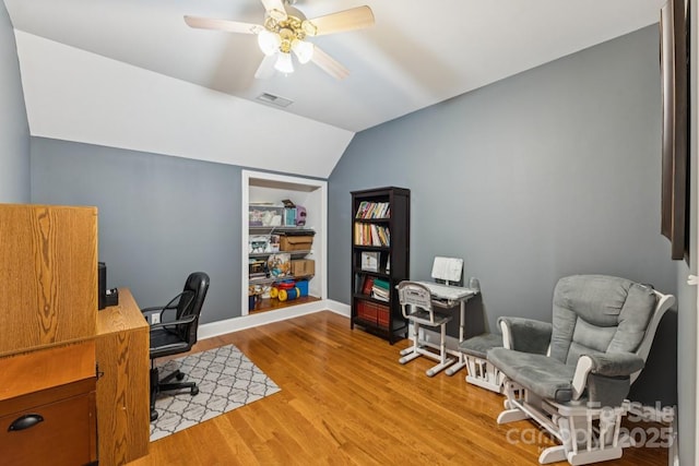 1123 Snyders Store Rd, Wingate, NC 28174 - office featuring lofted ceiling, wood finished floors, a ceiling fan, and built in shelves