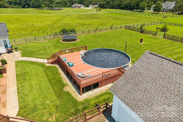 1123 Snyders Store Rd, Wingate, NC 28174 - fenced backyard featuring a view of countryside and a trampoline