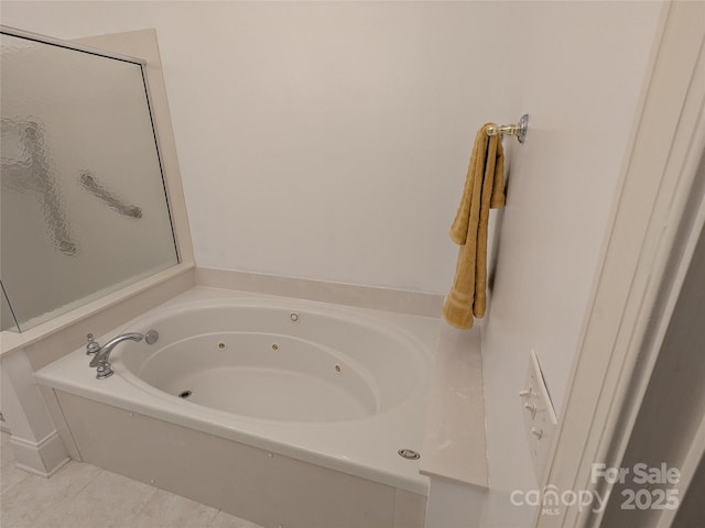 6301 Hawk Nest Dr, Concord, NC 28027 - bathroom featuring a jetted tub and tile patterned floors