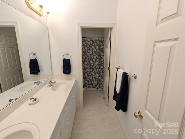 6301 Hawk Nest Dr, Concord, NC 28027 - bathroom with double vanity and tile patterned floors