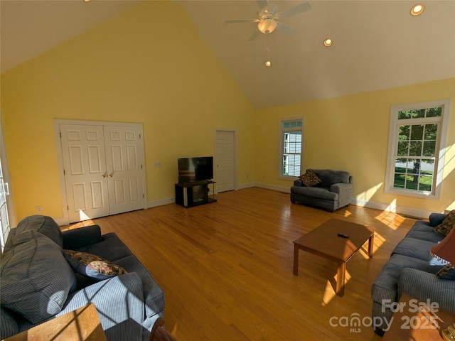 6301 Hawk Nest Dr, Concord, NC 28027 - living room with high vaulted ceiling, a ceiling fan, wood finished floors, and recessed lighting