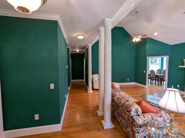 6301 Hawk Nest Dr, Concord, NC 28027 - living room with ornate columns, a ceiling fan, ornamental molding, wood finished floors, and vaulted ceiling