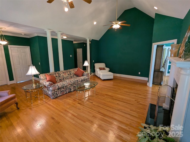 6301 Hawk Nest Dr, Concord, NC 28027 - living room with ornate columns, a ceiling fan, wood finished floors, crown molding, and high vaulted ceiling