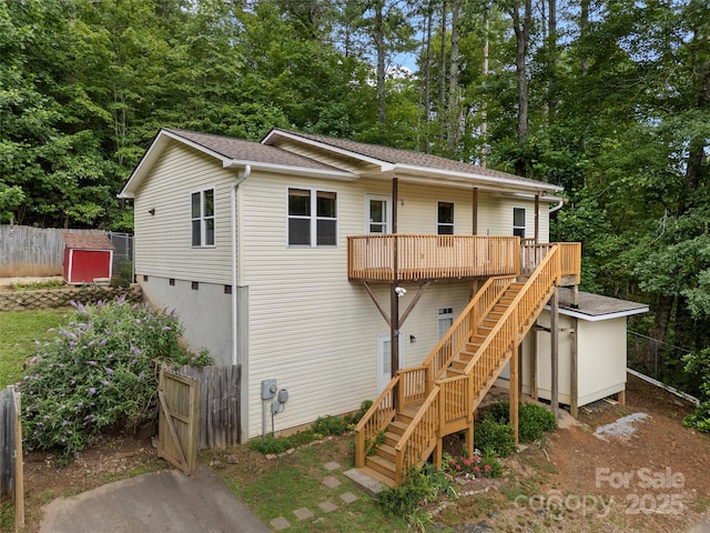 96 Habitat Way, Brevard, NC 28712 - rear view of property with stairs, a deck, view of wooded area, and a shingled roof
