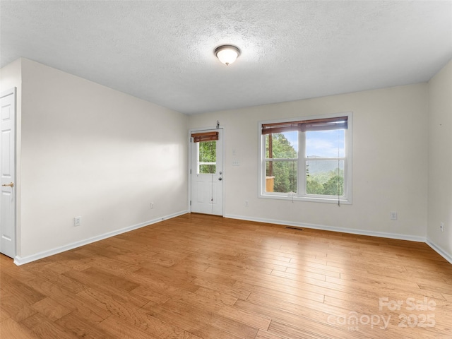 96 Habitat Way, Brevard, NC 28712 - unfurnished room featuring a textured ceiling and light wood finished floors
