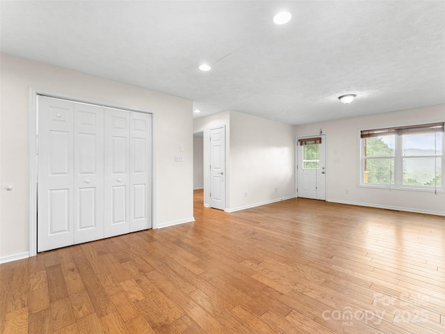 96 Habitat Way, Brevard, NC 28712 - unfurnished living room with light wood-style flooring and recessed lighting