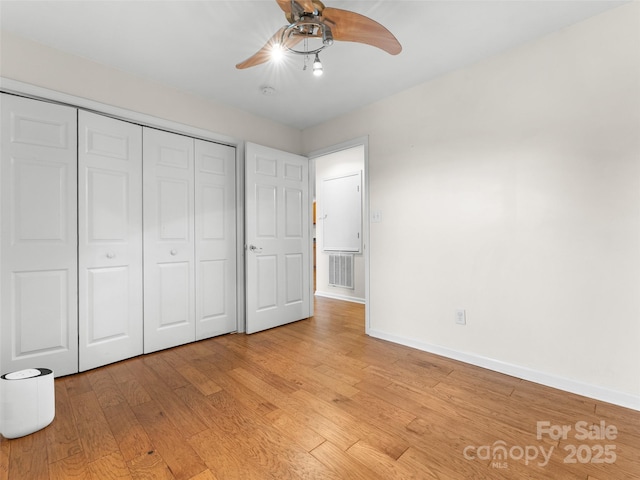 96 Habitat Way, Brevard, NC 28712 - unfurnished bedroom featuring light wood-style flooring, a closet, and ceiling fan