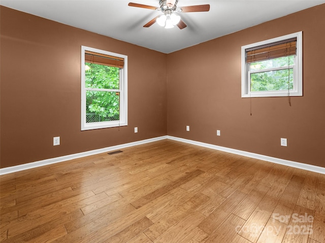 96 Habitat Way, Brevard, NC 28712 - spare room with healthy amount of natural light, light wood-type flooring, and a ceiling fan