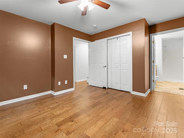 96 Habitat Way, Brevard, NC 28712 - unfurnished bedroom with light wood finished floors, a closet, and a ceiling fan