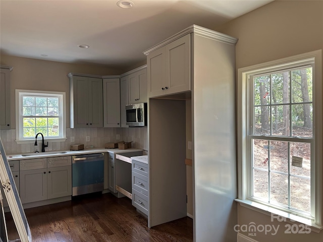1045 Long Dr, Newton, NC 28658 - kitchen featuring appliances with stainless steel finishes, light countertops, tasteful backsplash, dark wood-type flooring, and recessed lighting