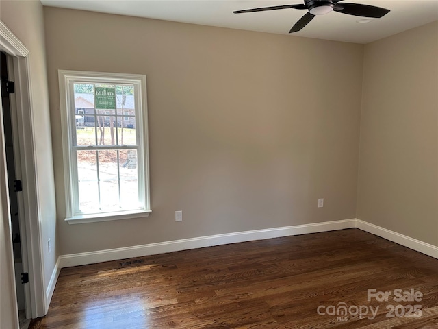 1045 Long Dr, Newton, NC 28658 - empty room with a ceiling fan and dark wood-style floors