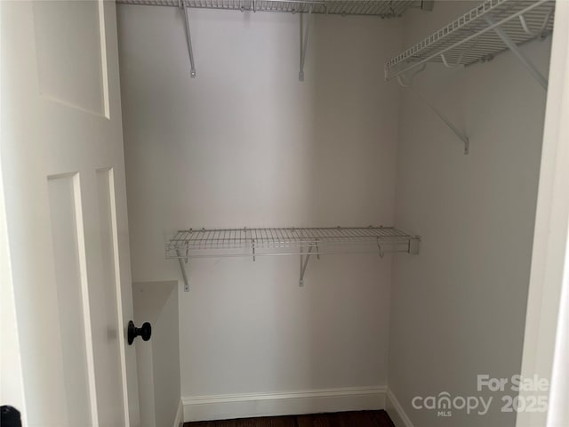 1045 Long Dr, Newton, NC 28658 - walk in closet with dark wood-type flooring