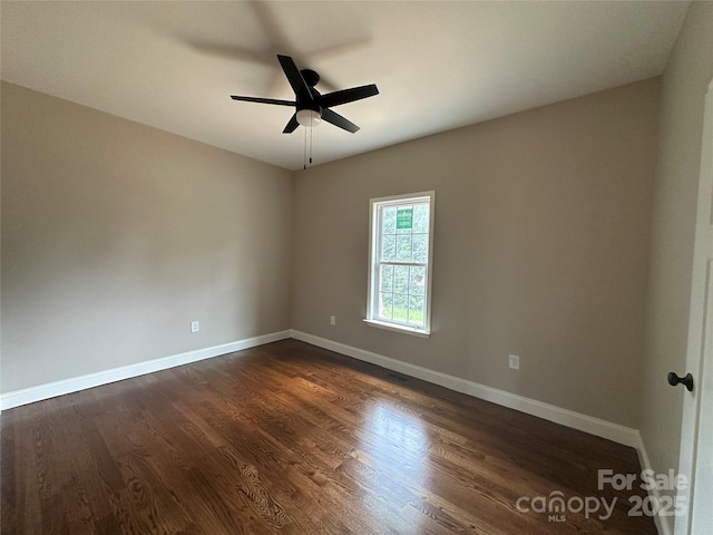 1045 Long Dr, Newton, NC 28658 - spare room featuring dark wood-type flooring and a ceiling fan