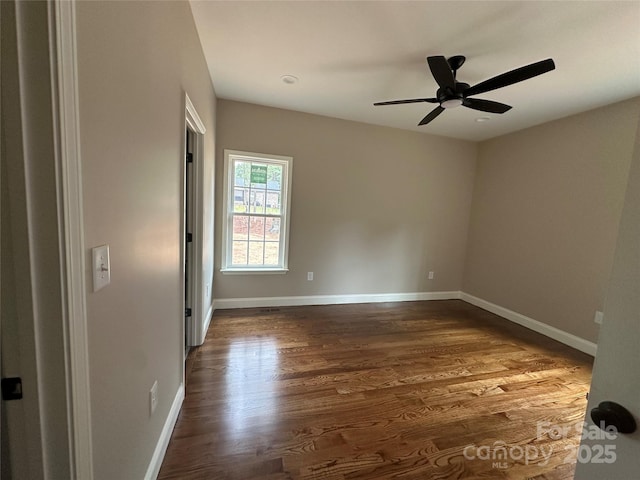 1045 Long Dr, Newton, NC 28658 - empty room featuring dark wood-style floors and ceiling fan
