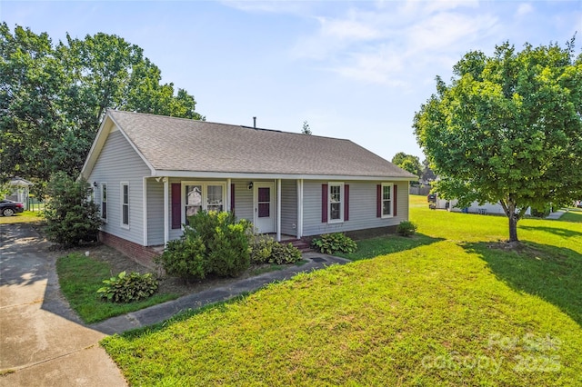 600 Piper Ct, Wingate, NC 28174 - view of front facade with a porch, a front lawn, and a shingled roof