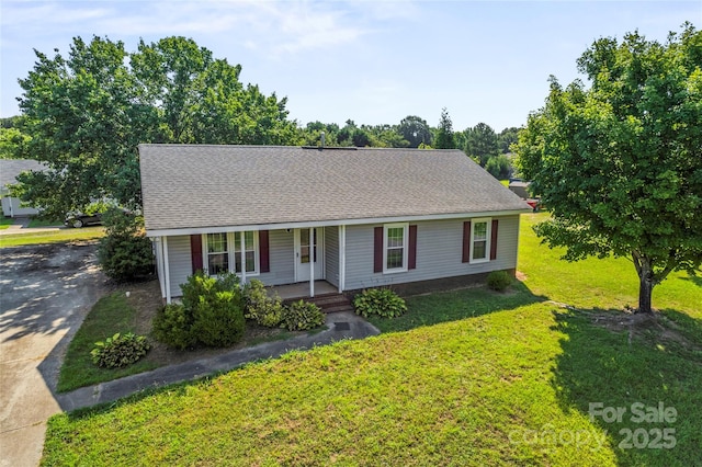 600 Piper Ct, Wingate, NC 28174 - view of front of property featuring covered porch, a front yard, concrete driveway, and a shingled roof