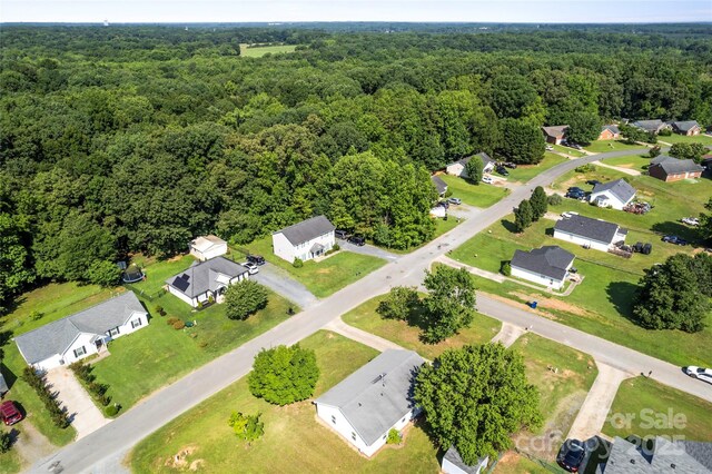 600 Piper Ct, Wingate, NC 28174 - aerial perspective of suburban area featuring a heavily wooded area