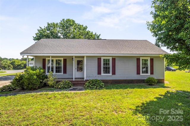 600 Piper Ct, Wingate, NC 28174 - ranch-style house featuring a porch, a front lawn, and a shingled roof