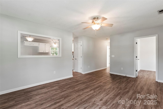 600 Piper Ct, Wingate, NC 28174 - unfurnished room featuring dark wood finished floors and a ceiling fan