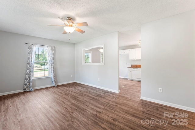 600 Piper Ct, Wingate, NC 28174 - spare room featuring wood finished floors, a ceiling fan, and a textured ceiling