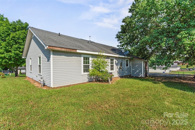 600 Piper Ct, Wingate, NC 28174 - rear view of house with a yard and a shingled roof