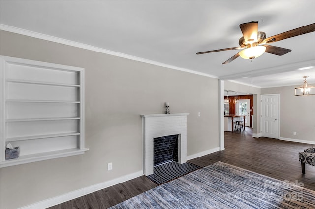 1641 Converse St, Lancaster, SC 29720 - living room with wood finished floors, ceiling fan, crown molding, built in shelves, and a brick fireplace