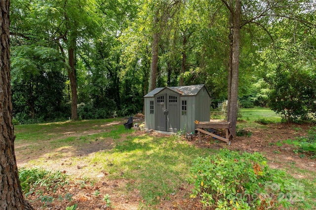 1641 Converse St, Lancaster, SC 29720 - view of green lawn featuring a shed and a view of trees