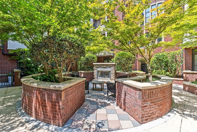 2810 Selwyn Ave Unit 429, Charlotte, NC 28209 - view of patio / terrace featuring an outdoor stone fireplace