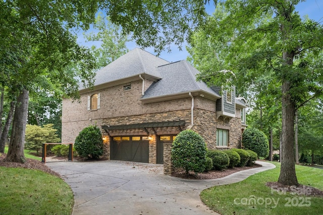 3519 Mcpherson St, Waxhaw, NC 28173 - view of side of home with driveway, a shingled roof, stone siding, an attached garage, and a lawn
