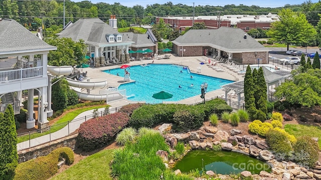 3519 Mcpherson St, Waxhaw, NC 28173 - community pool featuring a patio area, a water slide, and a pergola