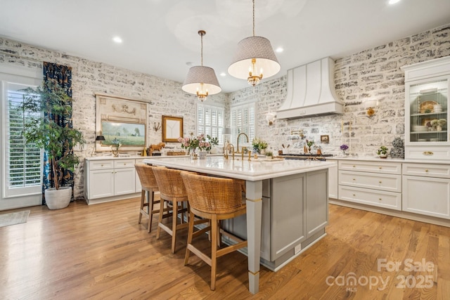 3519 Mcpherson St, Waxhaw, NC 28173 - kitchen with light countertops, plenty of natural light, an island with sink, recessed lighting, and wallpapered walls