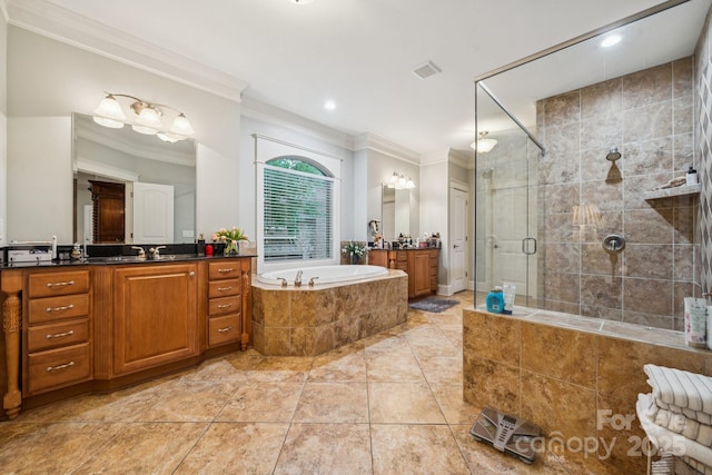 3519 Mcpherson St, Waxhaw, NC 28173 - bathroom featuring crown molding, vanity, a garden tub, a stall shower, and tile patterned flooring