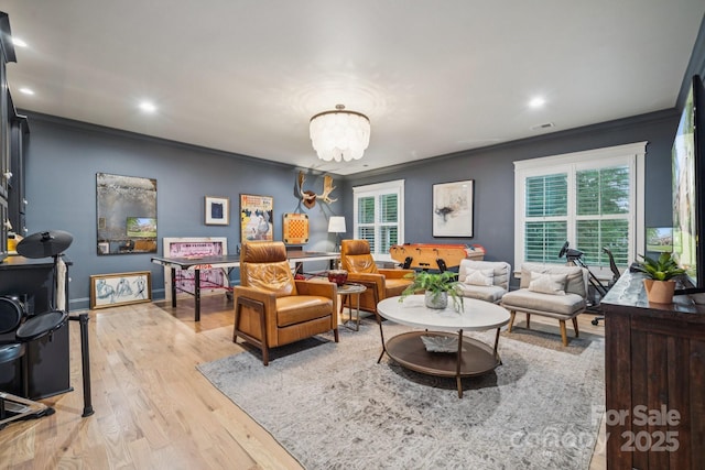 3519 Mcpherson St, Waxhaw, NC 28173 - living area featuring crown molding, plenty of natural light, light wood-type flooring, a chandelier, and recessed lighting