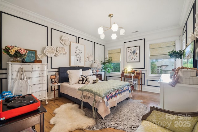 3519 Mcpherson St, Waxhaw, NC 28173 - bedroom featuring a chandelier, ornamental molding, and wood finished floors