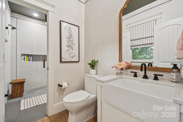 3519 Mcpherson St, Waxhaw, NC 28173 - bathroom featuring a stall shower, vanity, and wood finished floors