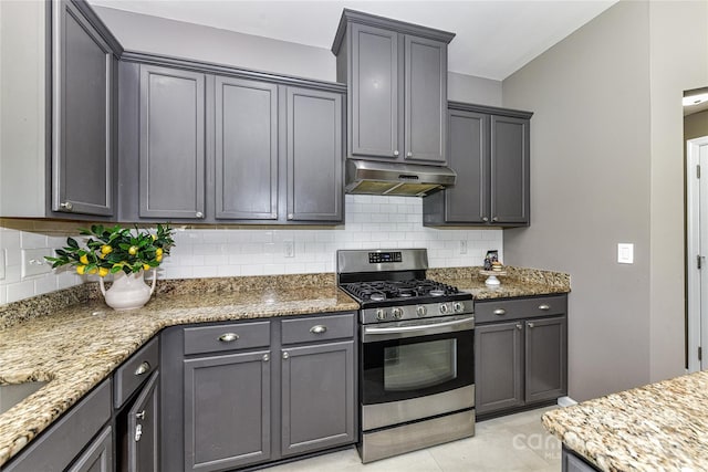 3533 Catherine Creek Pl, Davidson, NC 28036 - kitchen featuring stainless steel range with gas stovetop, under cabinet range hood, backsplash, light stone counters, and gray cabinetry
