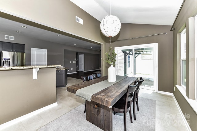 3533 Catherine Creek Pl, Davidson, NC 28036 - dining area featuring light tile patterned flooring, high vaulted ceiling, and recessed lighting