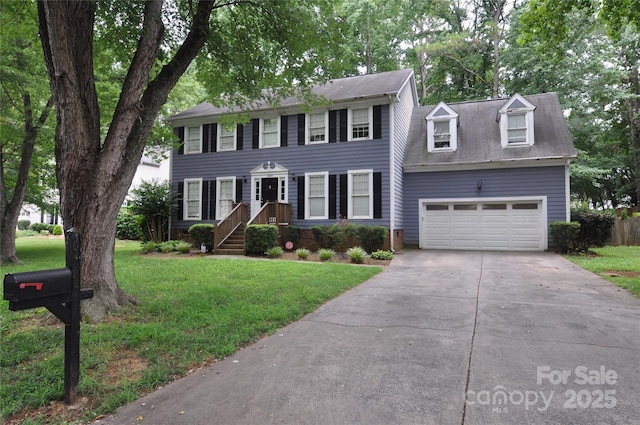 1324 Golden Hill Rd, Matthews, NC 28105 - colonial-style house featuring an attached garage, concrete driveway, and a front lawn